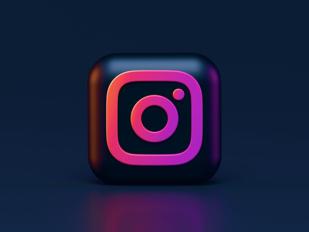 Instagram logo on a dark background.